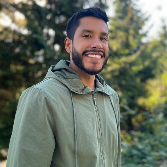 Federico Perez in light green overcoat in the outdoors