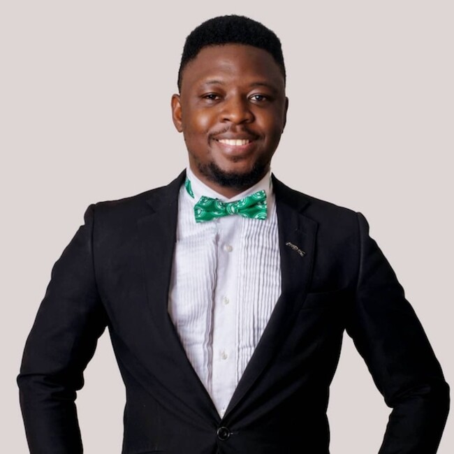 Babatunde Adewumi portrait wearing white shirt and black blazer